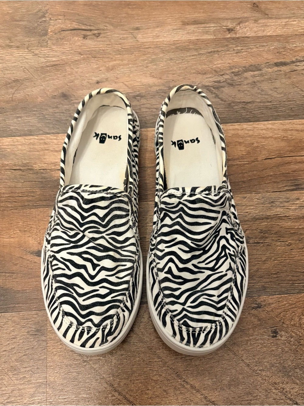 Sanuk Zebra Print Slip-On Shoes in Black and White